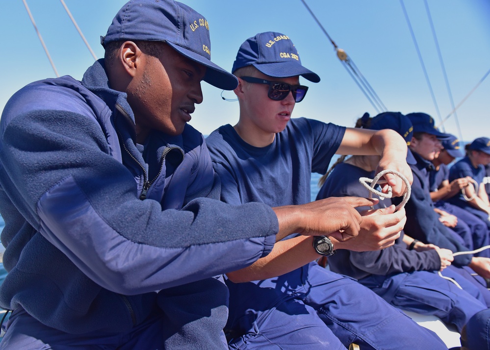 Basic seamanship training aboard Coast Guard Cutter Eagle includes knots, teamwork