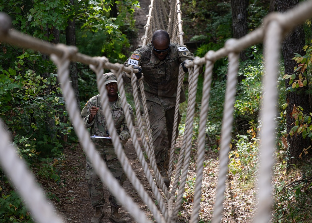 DVIDS - Images - Army Staff Sgt. Homer Pennington navigates a rope bridge  [Image 3 of 4]