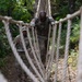 Army Staff Sgt. Homer Pennington navigates a rope bridge