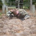 Cpl. Ryan Fordyce low-crawls under barbed wire