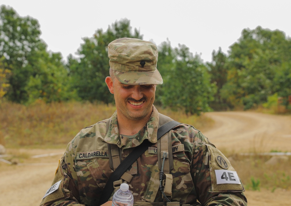 Spc. Anthony Calderra relaxes after completing the Day Land Navigation Course