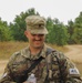 Spc. Anthony Calderra relaxes after completing the Day Land Navigation Course