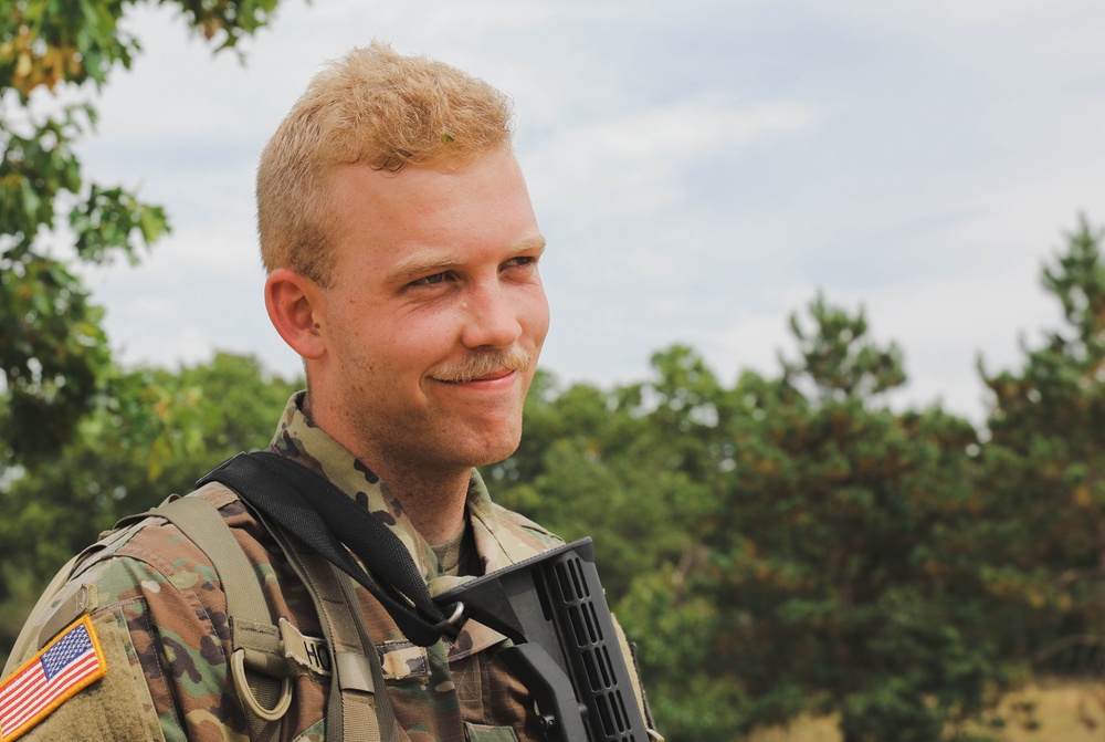 Spc. Wesley E Horner relaxes after completing the Day Land Navigation Course