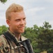 Spc. Wesley E Horner relaxes after completing the Day Land Navigation Course