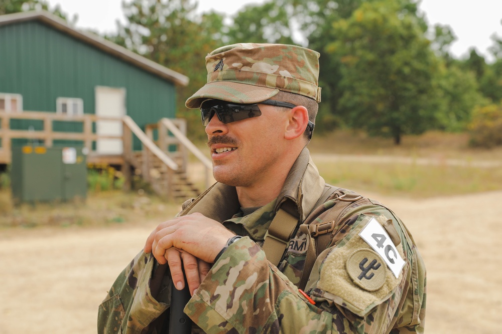 Spc. Trenton Rumba relaxes after completing the Day Land Navigation Course