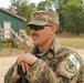 Spc. Trenton Rumba relaxes after completing the Day Land Navigation Course