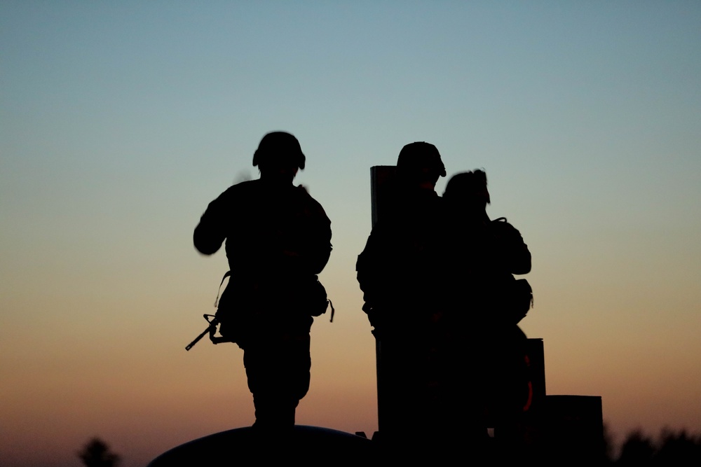 U.S. Army Reserve Best Squad Competitors wait to shoot during the night qualification