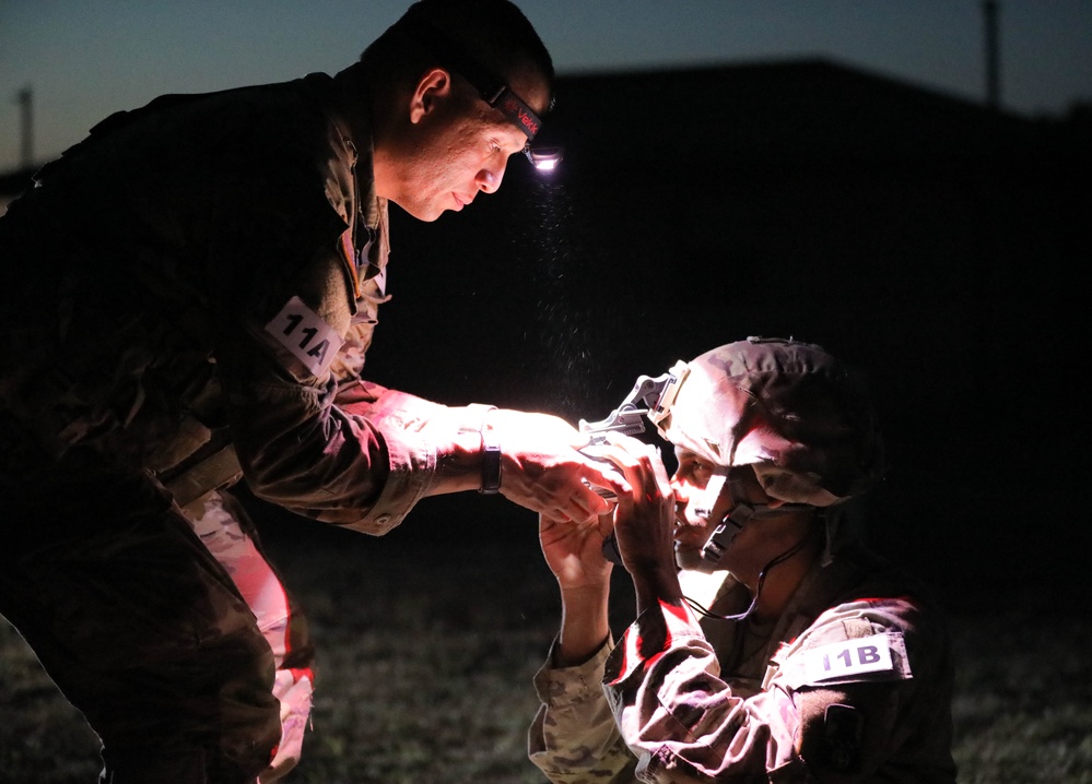 Sgt. Danny Marrerocaballero receives instruction on assembling a Night Observation Device