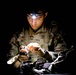 Spc. Stephan Mixter assembles a Night Observation Device during the M4 Night Qualification event