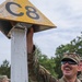 Spc. Trenton Rumba celebrates finding a checkpoint during the day land navigation event