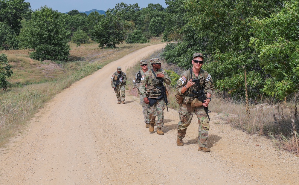 U.S. Army Reserve Best Squad competitors on their final stretch for the day land navigation event.