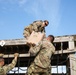 Army Reserve Best Squad competitors work together to navigate an obstacle course