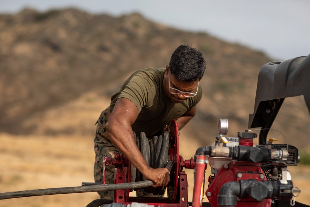 Cease Fire!: MCBH Range Maintenance Personnel spray fire retardant at Crater Range