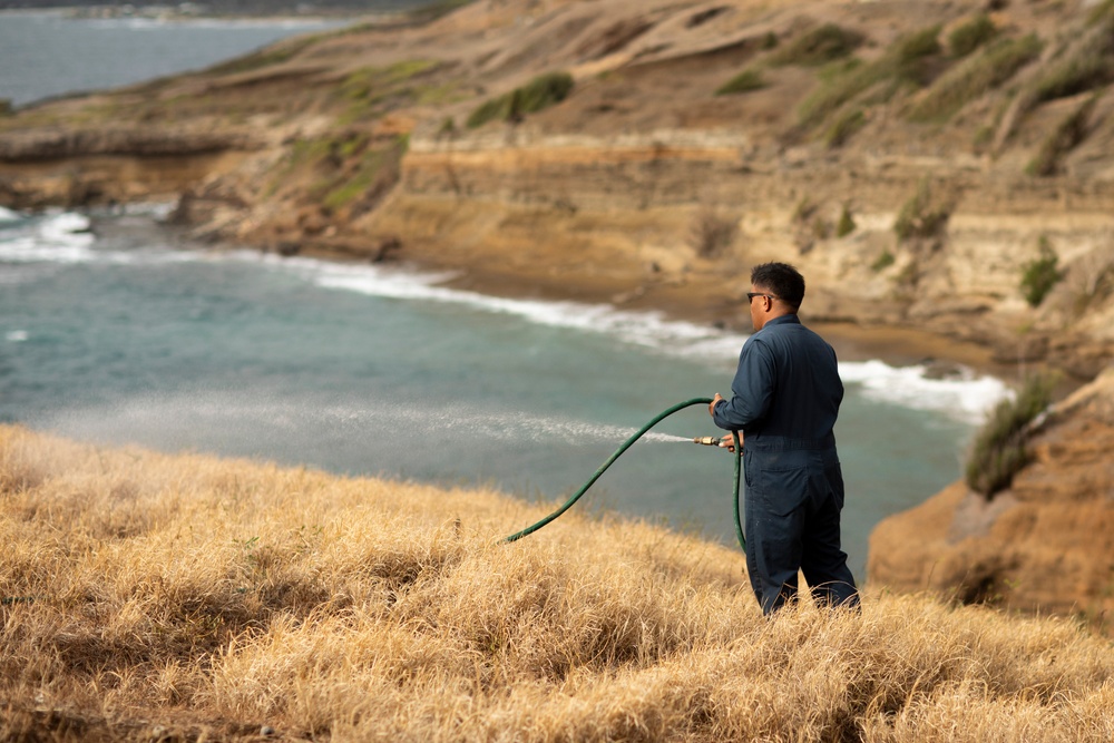 Cease Fire!: MCBH Range Maintenance Personnel spray fire retardant at Crater Range