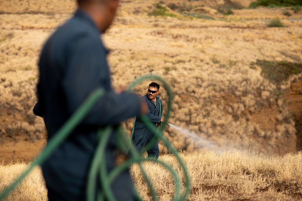 Cease Fire!: MCBH Range Maintenance Personnel spray fire retardant at Crater Range