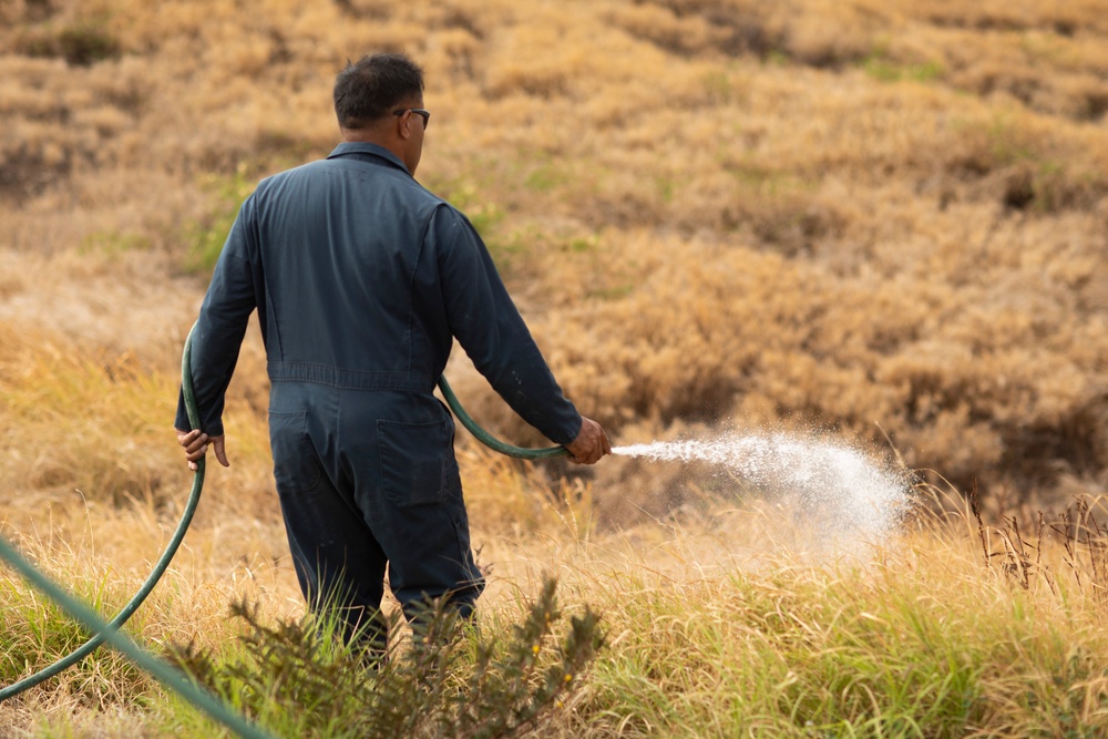 Cease Fire!: MCBH Range Maintenance Personnel spray fire retardant at Crater Range