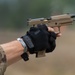 Army Spc. Carlin Houston fires the M17 pistol