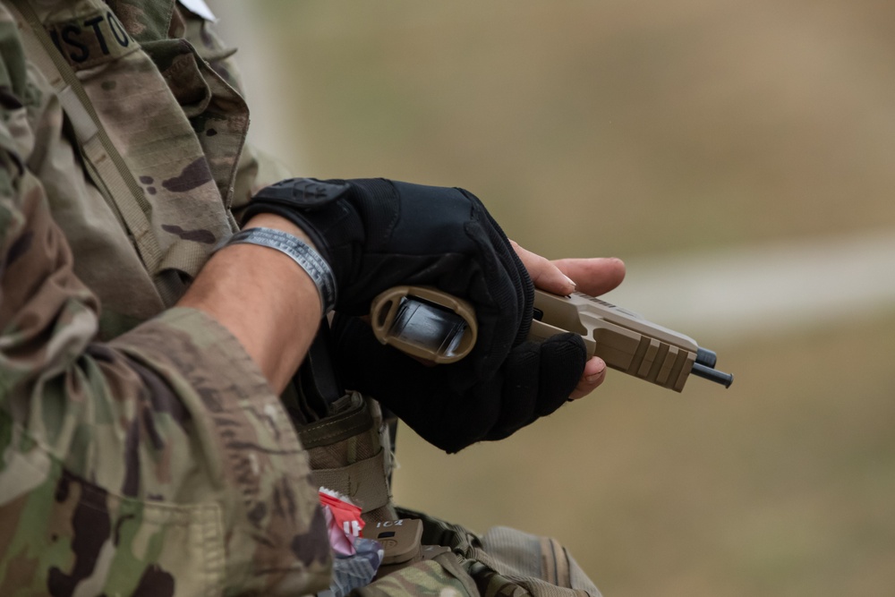 Army Spc. Carlin Houston qualifies with the M17 pistol