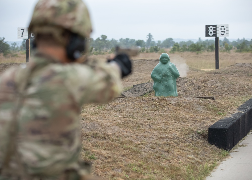 Army Spc. Carlin Houston fires the M17 pistol