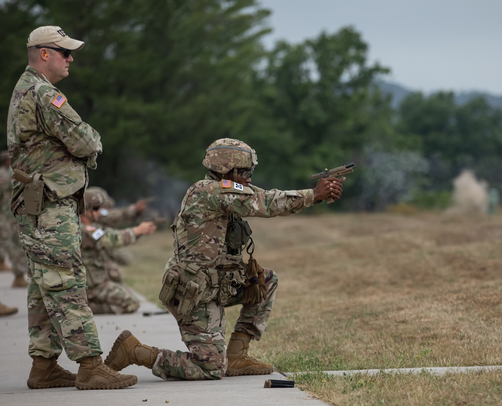 Army Sgt. Mayard Delphin fires the M17 pistol