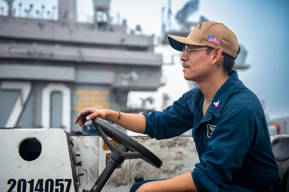 Sailor Operates an Aircraft Tractor Aboard USS Carl Vinson (CVN 70)