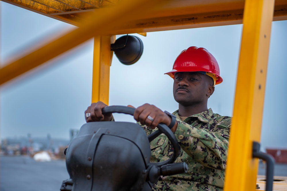 Sailor Operates a Forklift Aboard USS Carl Vinson (CVN 70)