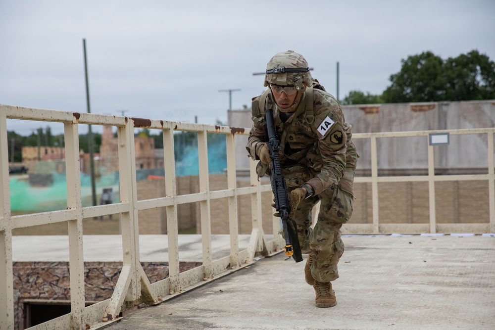 Sgt. First Class Juan Torres runs to cover