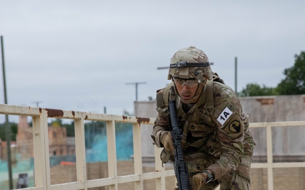 Sgt. First Class Juan Torres runs to cover