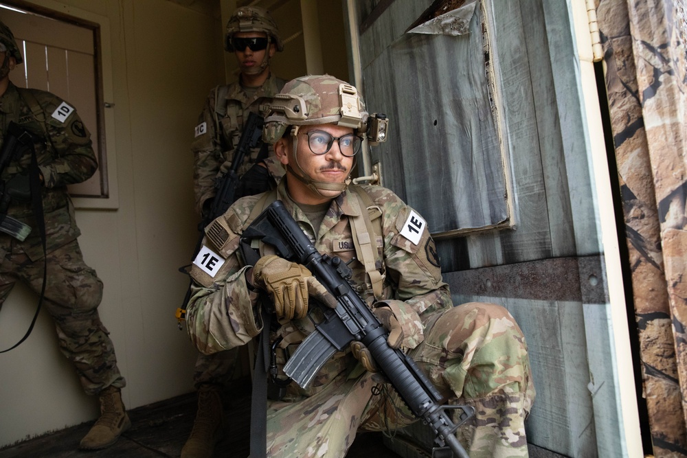 Spc. Nelson Medina goes through the tunnel and intel collection lane