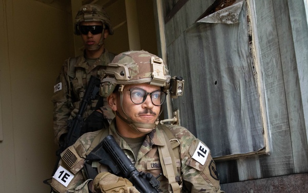 Spc. Nelson Medina goes through the tunnel and intel collection lane