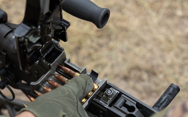 All Army Reserve Best Squad competitors work together as they qualify on the M249