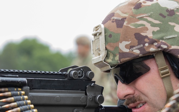 Spc. Coby Ecestein fires the M249
