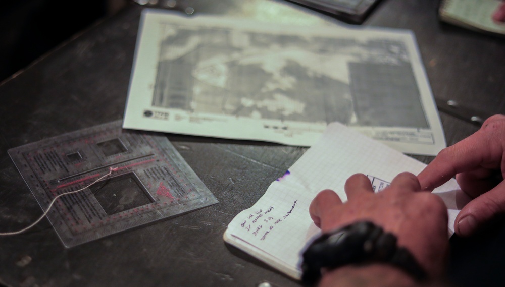 U.S. Army Reserve Best Squad competitors prepare the map for the night land navigation event.