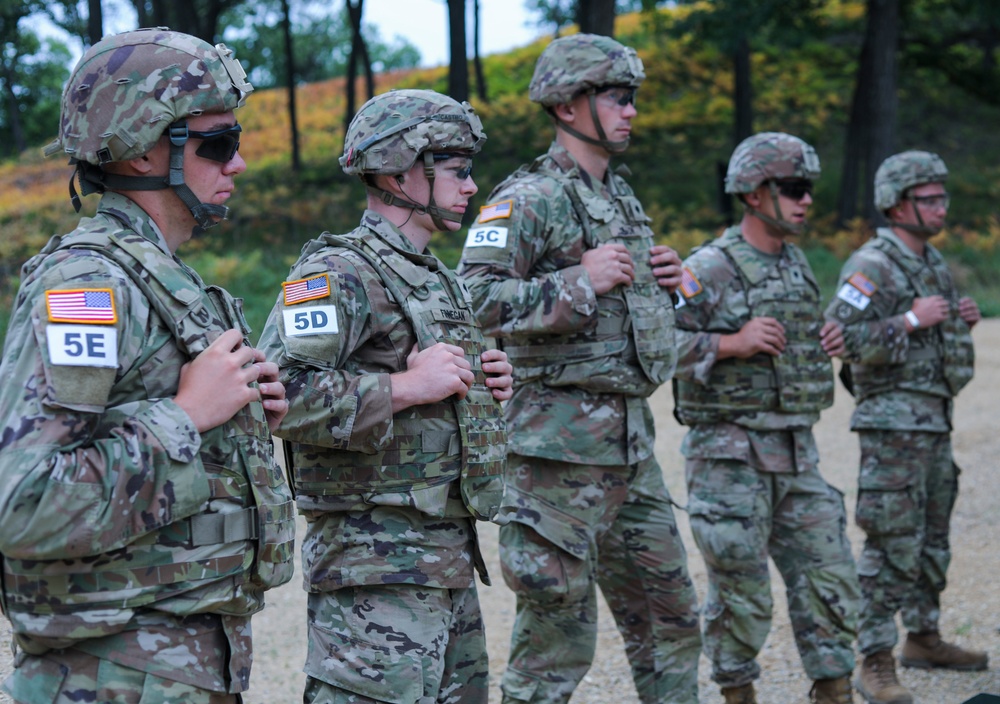 U.S. Army Reserve Best Squad Competitors receive instruction during the live grenade event.