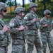 U.S. Army Reserve Best Squad Competitors receive instruction during the live grenade event.