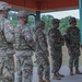 U.S. Army Reserve Best Squad competitors line up to receive M781 training grenade launcher grenades.