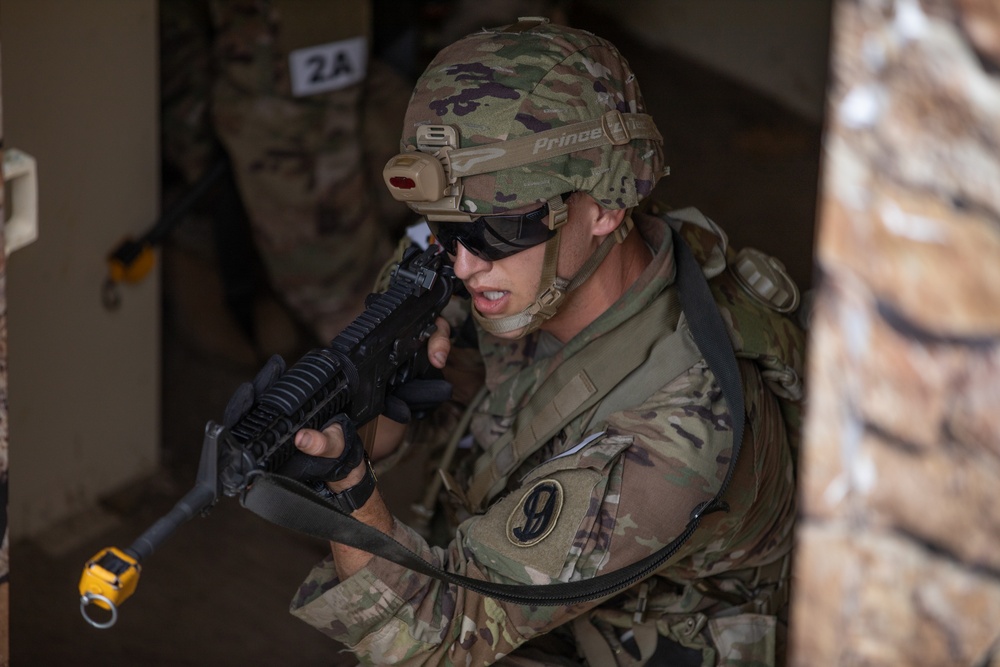 Spc. Carlin Houston aims down his sights