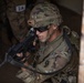 Spc. Carlin Houston aims down his sights