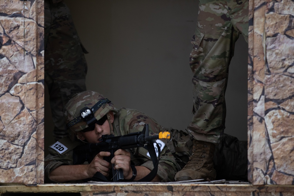 Spc. Elihu W. Wagner aims down his sights