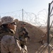 U.S. Marines, Army service members post security at an entry control point.