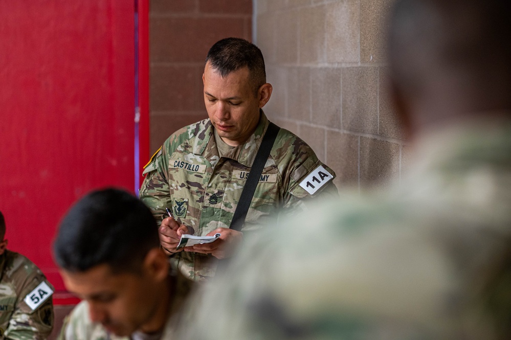 Sgt. 1st Class Luis Castillo takes notes