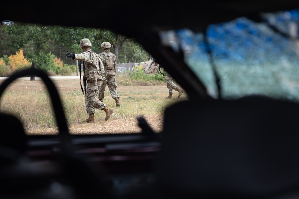 Army Reserve Best Squad competitors navigate a simulated warzone