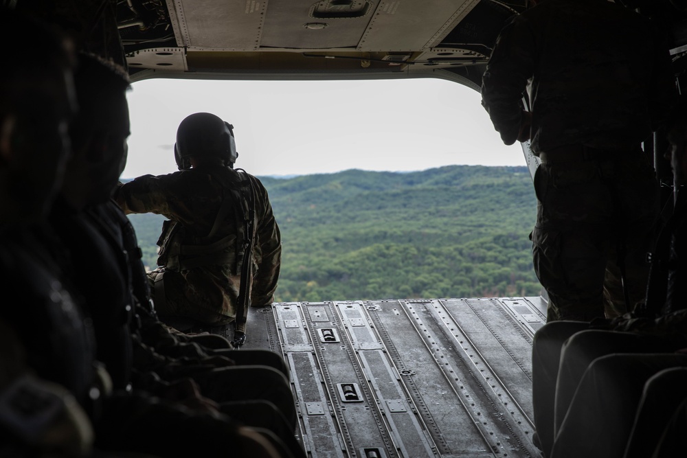 Army Reserve Best Squad competitors ride in a CH-47 Chinook