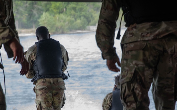 Army Reserve Best Squad competitors jump into Big Sandy Lake
