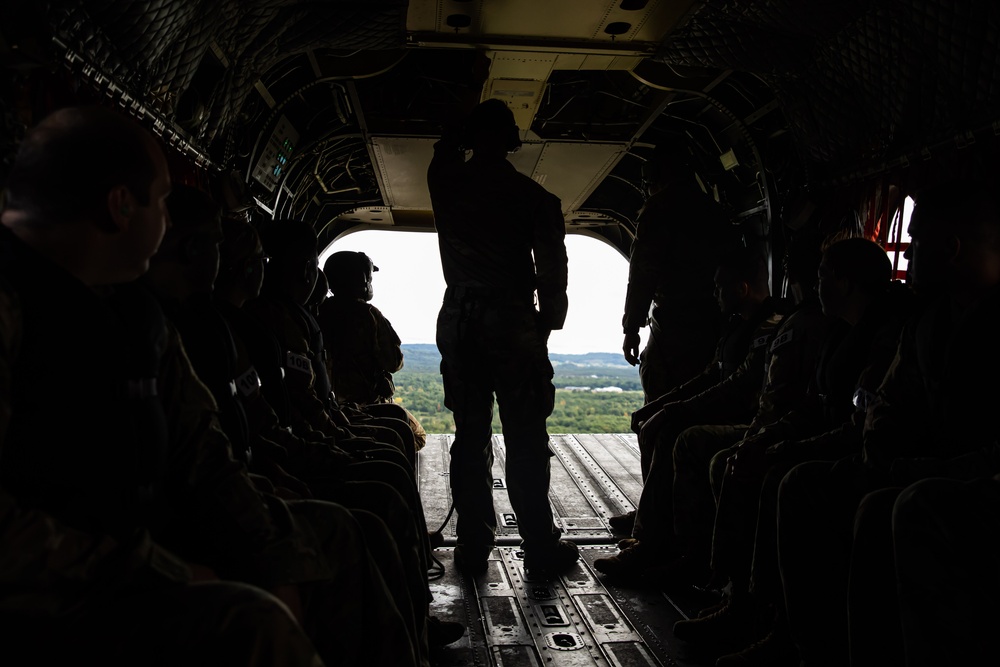 Army Reserve Best Squad competitors fly in a CH-47 Chinook