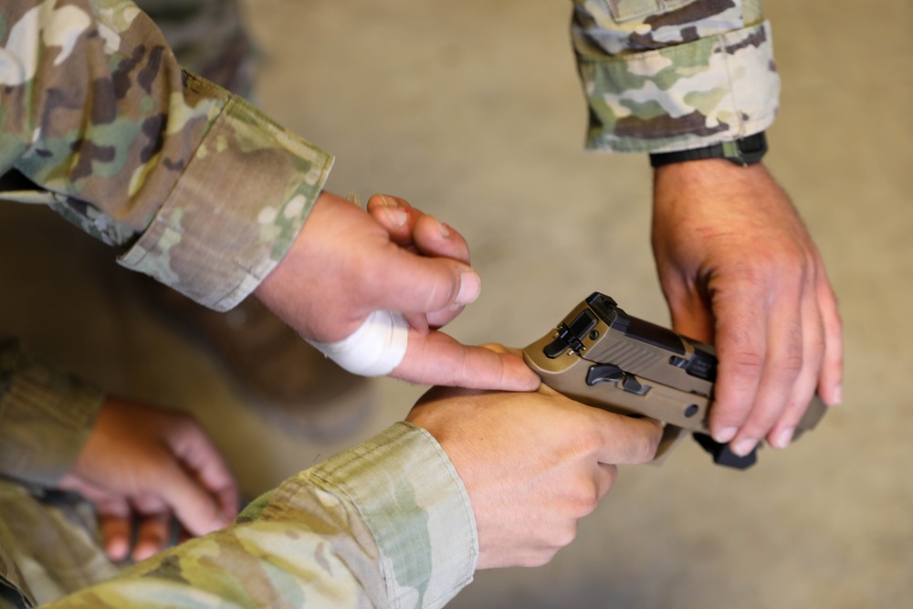 U.S. Army Reserve Best Squad Competitors discuss M17 marksmanship