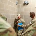 An instructor times U.S. Army Reserve Best Squad Competitors during the Box O' Guns event