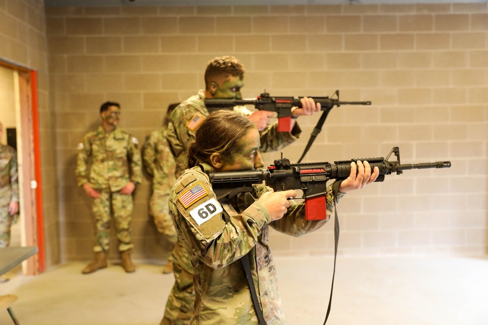 Sgt. Amanda Edgerton aims an M4 equipped with a MantisX shooting analysis system