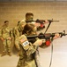 Sgt. Amanda Edgerton aims an M4 equipped with a MantisX shooting analysis system