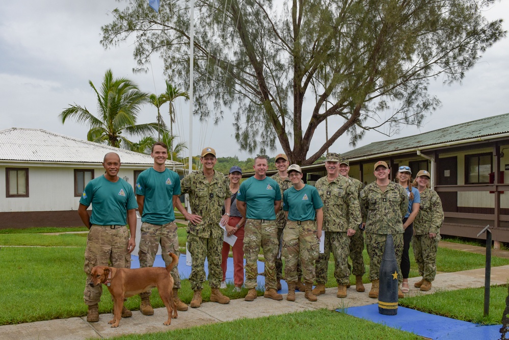 Rear Adm. Gregory Huffman visits service members stationed on Palau as part of the Civic Action Team